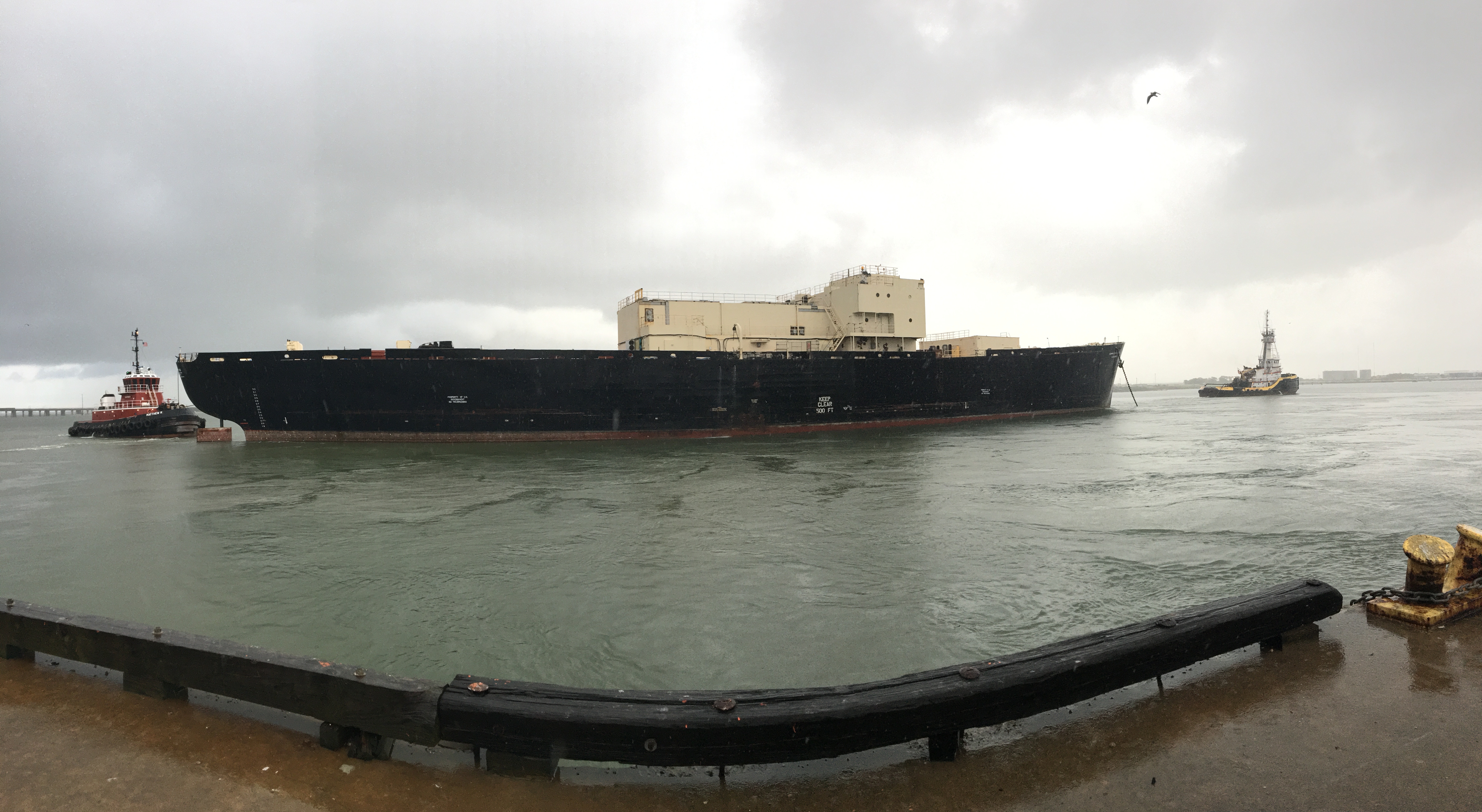 The STURGIS is towed from the Galveston pier to the shipping channel September 25, 2018 as it heads toward Brownsville, Texas for final shipbreaking and recycling.